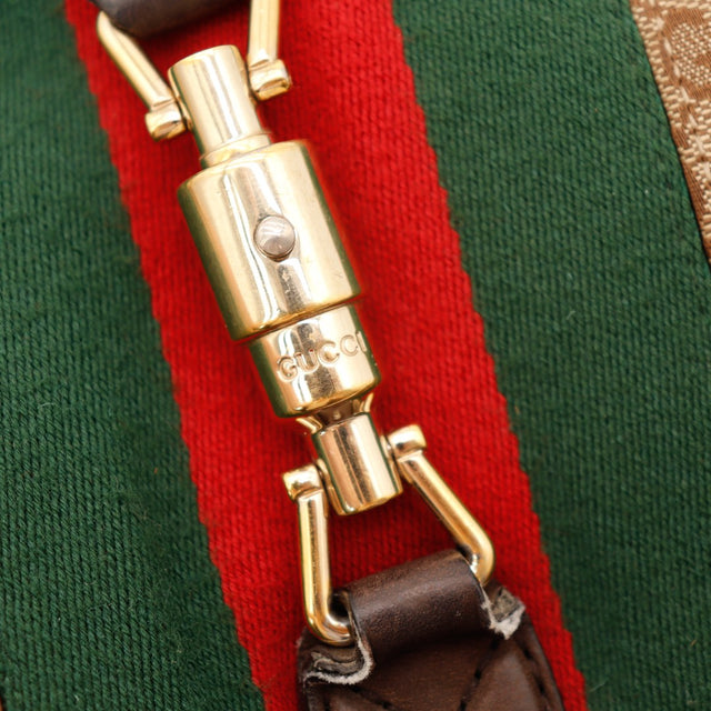 Détail fermoir piston doré Gucci New Jackie bande rouge verte — AMANA Vintage