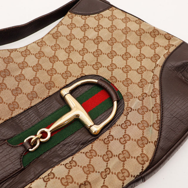 Détail mors Horsebit doré et ruban Web vert rouge Gucci — AMANA Vintage