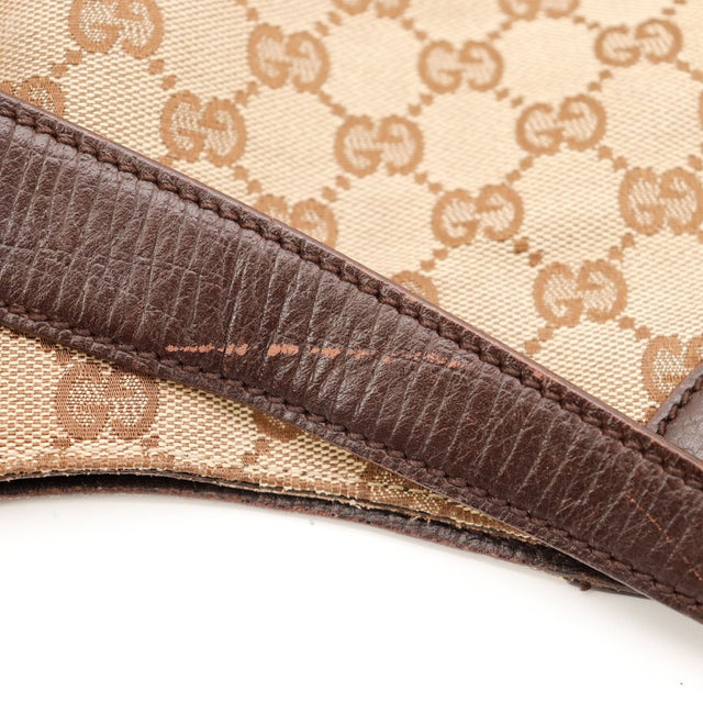 Détail canvas GG et cuir marron Gucci Hobo Horsebit occasion — AMANA Vintage