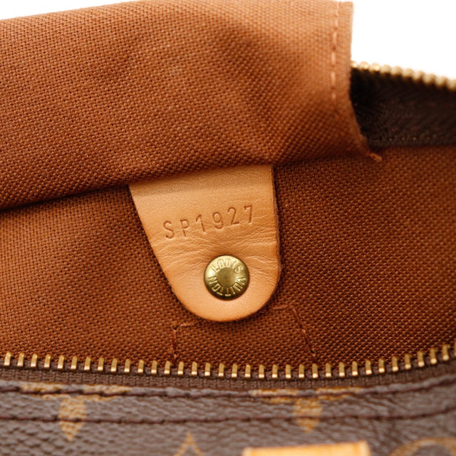 Détail cadenas et languette vachette Louis Vuitton Speedy 30 — AMANA Vintage