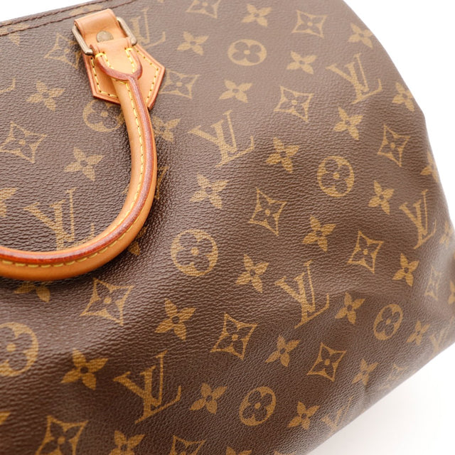 Detail tirette cuir zip Louis Vuitton Speedy 40 vachette caramel — AMANA Vintage