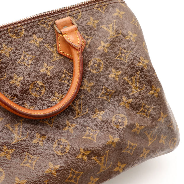 Detail languette zip et vert-de-gris Louis Vuitton Speedy 35 — AMANA Vintage