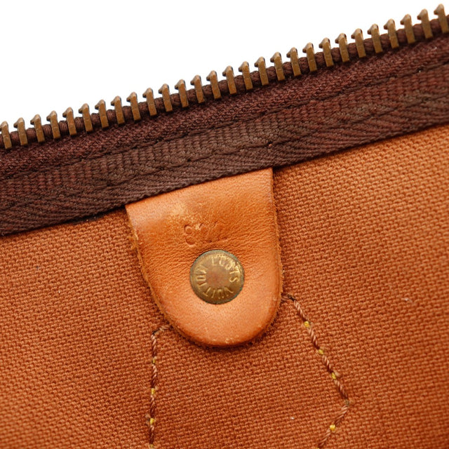 Detail tab vachette Louis Vuitton Speedy 35 patine caramel — AMANA Vintage