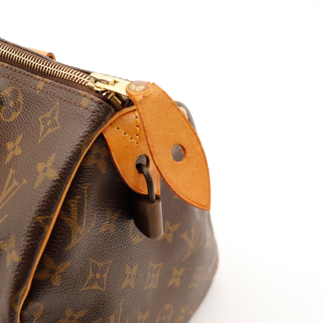 Detail languette cadenas Louis Vuitton Speedy 30 vachette — AMANA Vintage