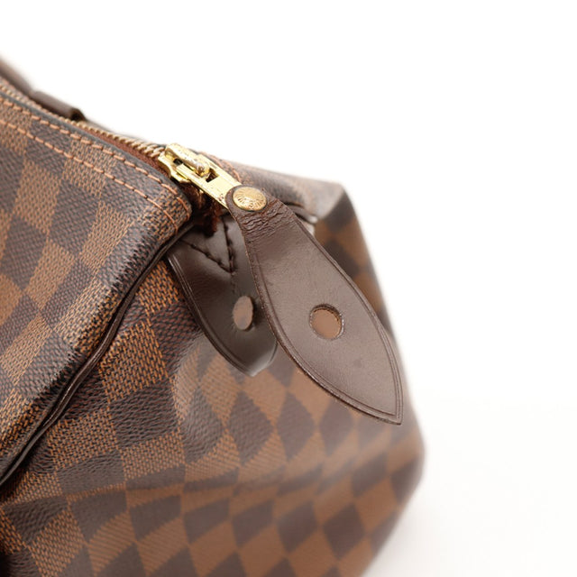 Détail tab cuir et zip Louis Vuitton Speedy 30 Damier Ebène occasion — AMANA Vintage