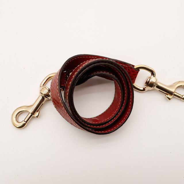 Detail anse ronde python rouge plaque Gucci Indy Hobo occasion — AMANA Vintage