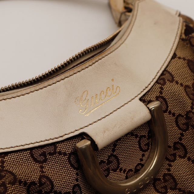 Détail intérieur doublure textile marron Gucci Hobo propre — AMANA Vintage