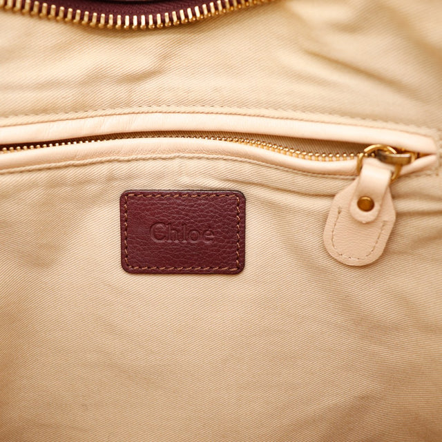 Détail coins inférieurs cuir bordeaux Chloé Paraty occasion authentique — AMANA Vintage