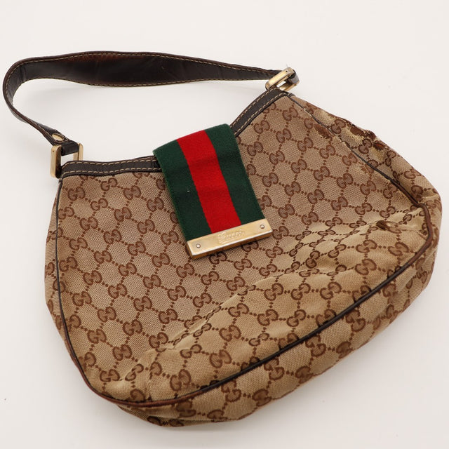 Vue à plat Hobo Web Gucci bande Web plaque dorée Gucci — AMANA Vintage