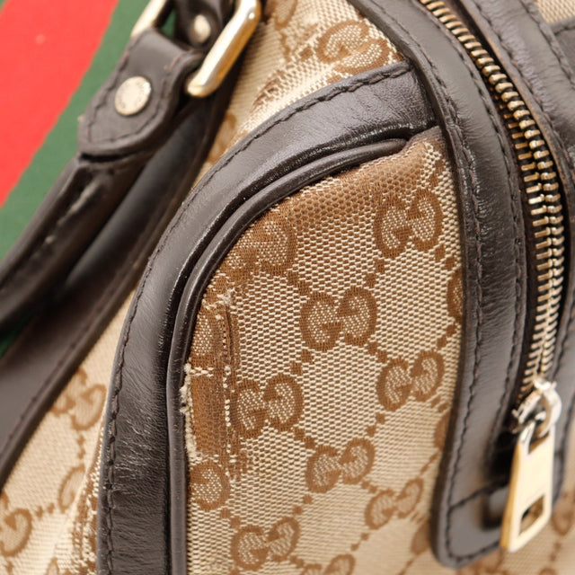 Détail coin supérieur anses cuir vernis Gucci Boston Joy Web occasion — AMANA Vintage