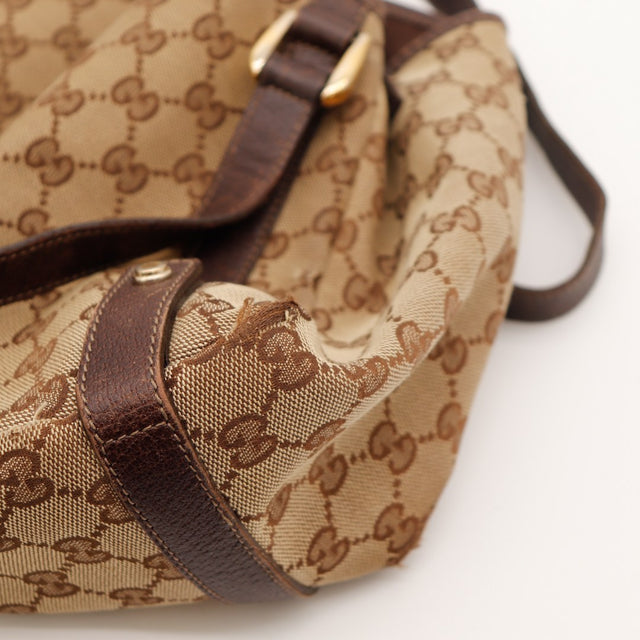 Détail garniture cuir marron inscription Gucci sac Hobo — AMANA Vintage