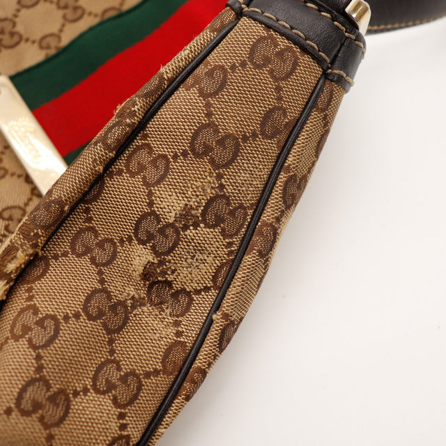 Détail anse et boucle métal Hobo Web Gucci cuir noir occasion — AMANA Vintage