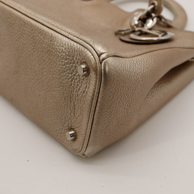 Vue coin bas Dior Diorissimo cuir grené taupe occasion — AMANA Vintage