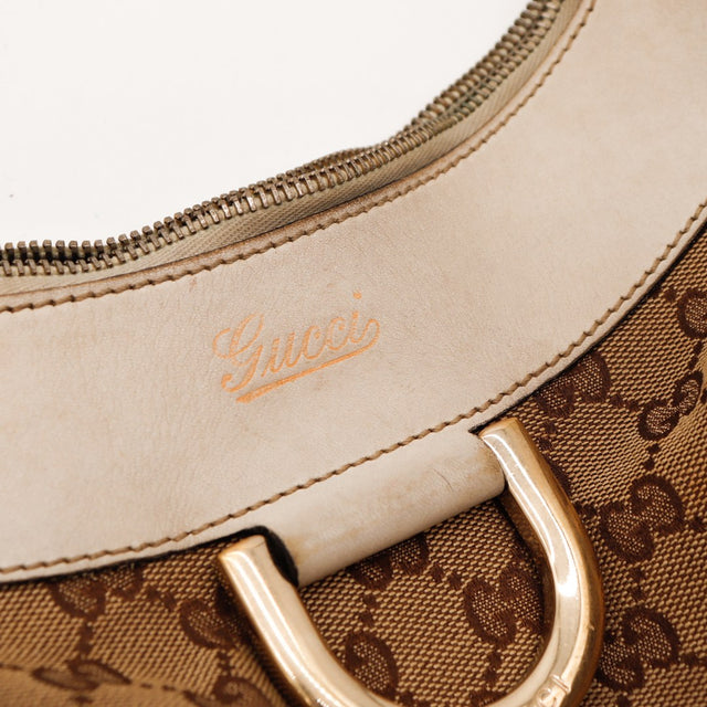 Détail curseur zip et fixation anse cuir ivoire usé Hobo Gucci — AMANA Vintage