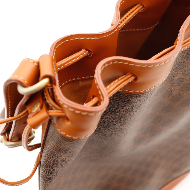 Détail cordelette et anneau doré Céline Seau Macadam — AMANA Vintage