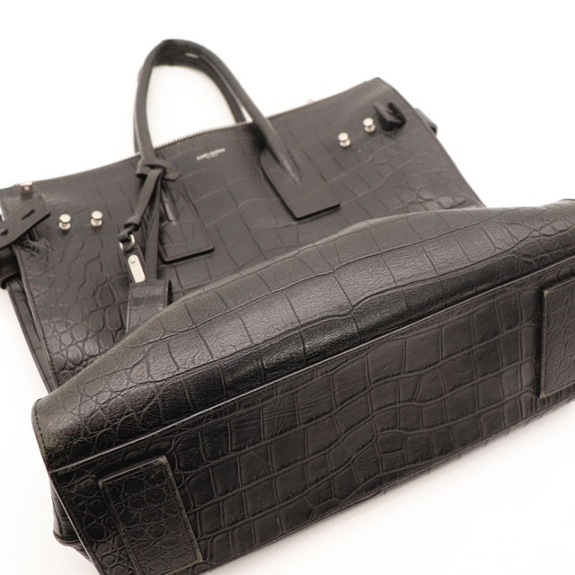 Vue de l'intérieur Saint Laurent Sac de Jour Souple cuir embossé façon crocodile noir occasion authentique — AMANA Vintage