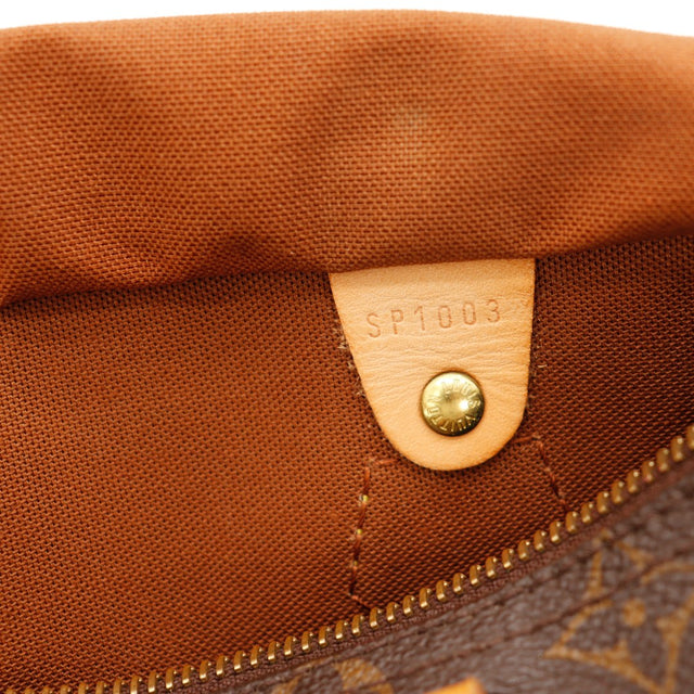 Détail tirette et languette cadenas Louis Vuitton Speedy 25 — AMANA Vintage