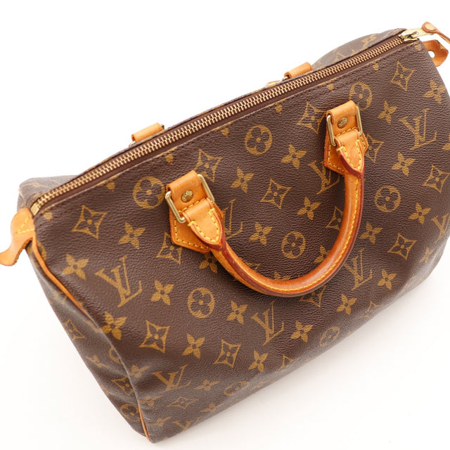 Détail anse et attache cuir Louis Vuitton Speedy 30 patine caramel — AMANA Vintage