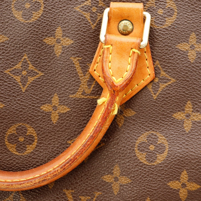 Détail anse et attache cuir vachette patiné Louis Vuitton Speedy 30 — AMANA Vintage