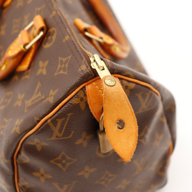 Détail tirette en cuir zip Louis Vuitton Speedy 30 usure légère — AMANA Vintage