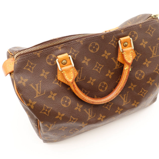 Vue rapprochée anses cuir vachette patiné Louis Vuitton Speedy 30 — AMANA Vintage