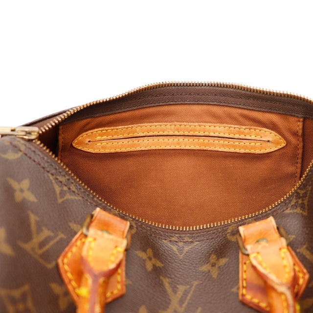 Détail date code et languette cadenas Louis Vuitton Speedy 25 — AMANA Vintage