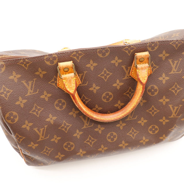 Détail anses Louis Vuitton Speedy 35 cuir vachette caramel usage — AMANA Vintage