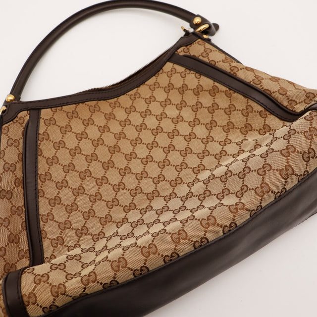 Détail toile monogrammée Gucci Hobo occasion authentique — AMANA Vintage