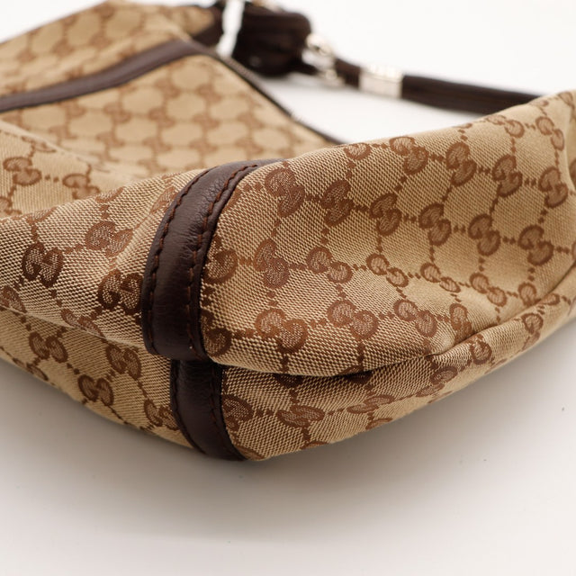 Détail base et garniture cuir Gucci Hobo Bamboo occasion authentique — AMANA Vintage