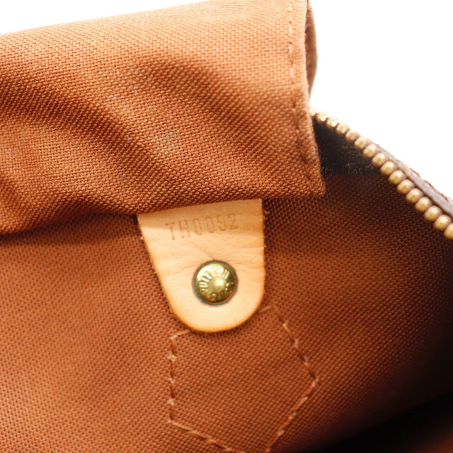 Détail des pattes d'attache Louis Vuitton Speedy 30 cuir vachette occasion authentique — AMANA Vintage