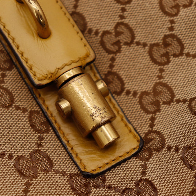 Détail plaquage doré fermoir Gucci Hobo Bamboo occasion authentique — AMANA Vintage