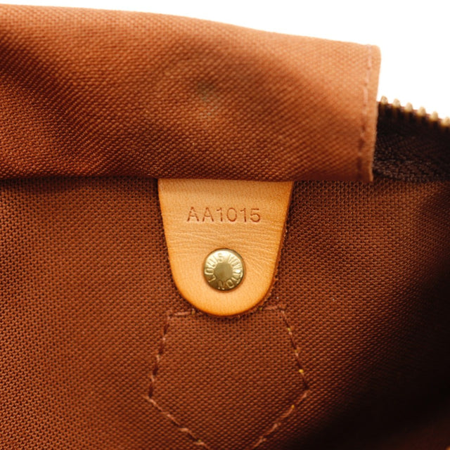 Détail des attaches des anses Louis Vuitton Speedy 30 Toile Monogramme occasion authentique — AMANA Vintage