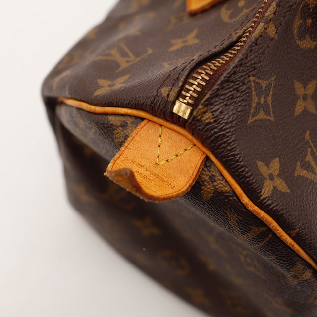 Détail de la fermeture Louis Vuitton Speedy 30 Toile Monogramme occasion authentique — AMANA Vintage