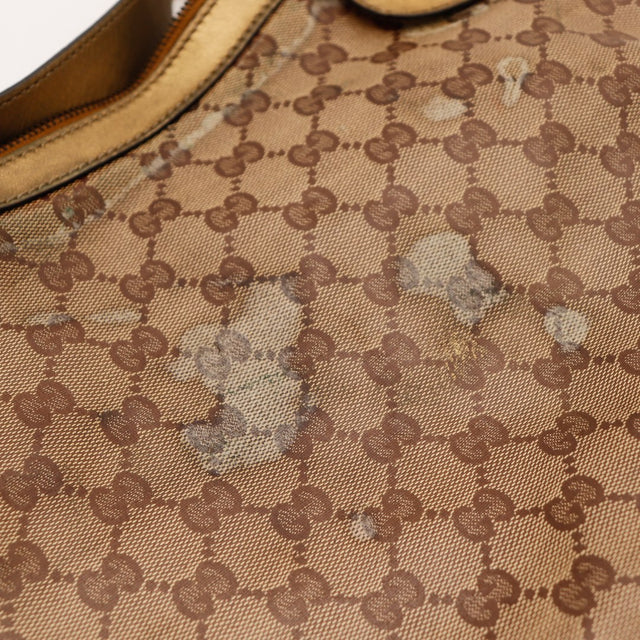 Détail toile monogrammée avec marques d'usage Gucci Hobo Babouska occasion authentique — AMANA Vintage