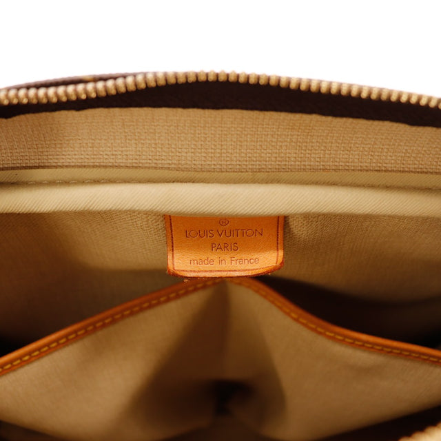 Détail étiquette et clochette Louis Vuitton Deauville occasion authentique — AMANA Vintage