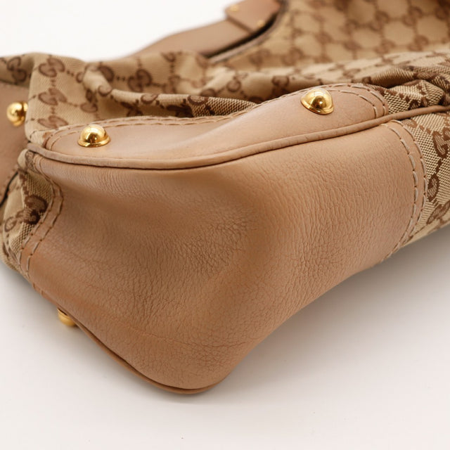Detail coin cuir et clous dorés Gucci Hobo — AMANA Vintage