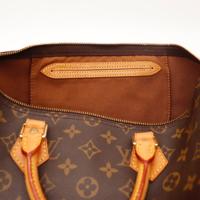 Détail des anses Louis Vuitton Speedy 35 cuir vachette occasion authentique — AMANA Vintage