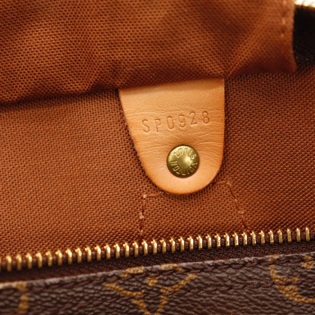 Détail des attaches d'anses Louis Vuitton Speedy 35 Toile Monogramme occasion authentique — AMANA Vintage