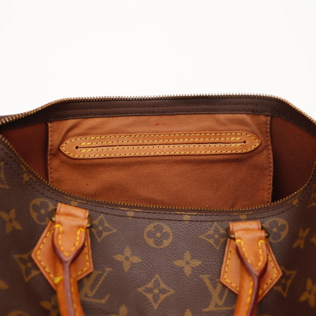 Détail des anses Louis Vuitton Speedy 30 Toile Monogramme et cuir vachette occasion authentique — AMANA Vintage