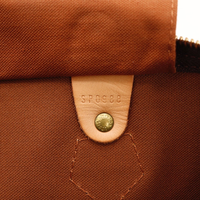 Détail de la patine Louis Vuitton Speedy 30 cuir vachette occasion authentique — AMANA Vintage