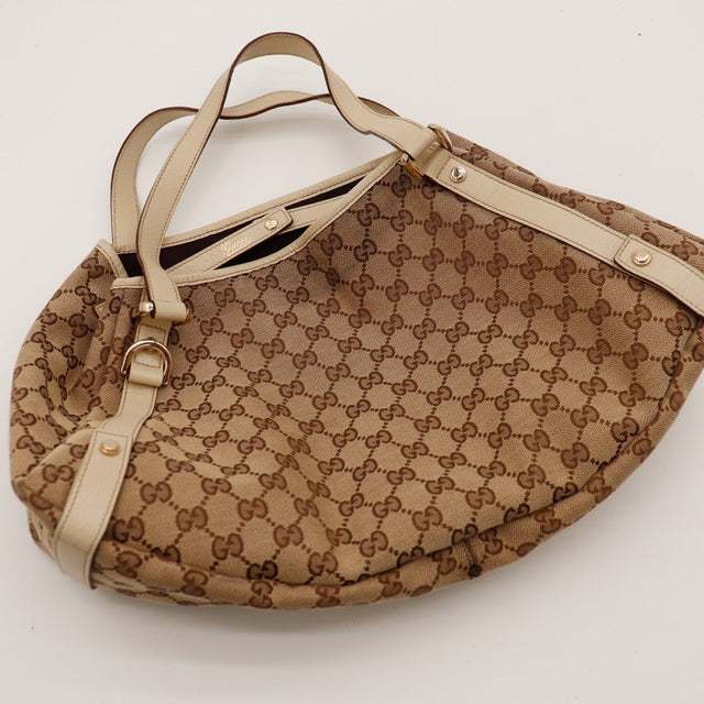 Hobo Gucci detail ouverture et anses cuir ivoire — AMANA Vintage